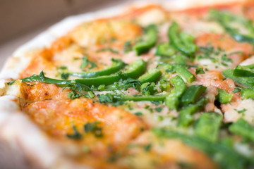 Italian pizza with green pepper in paper box tasty macro picture useful for background