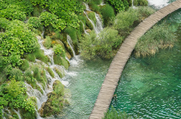 Aerial view overlooking a timber walkway, and waterfalls in the beautiful Plitvice Lakes National...