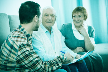 Fototapeta premium Elderly couple and insurance agent