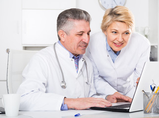 Fototapeta premium Doctor and nurse reading information