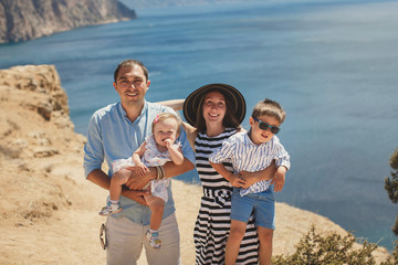 Fototapeta premium Portrait of happy family outdoors in the mountains.