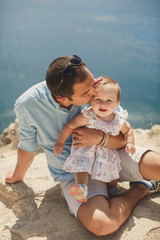 Dad kisses daughter