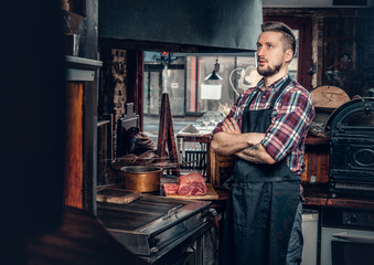 Portrait of stylish cook on a kitchen.