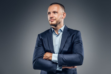 A man dressed in a stylish blue jacket.