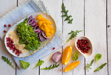 salad with rucola and pomegranate seeds