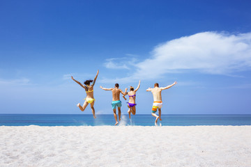 Happy friends on lonely beach