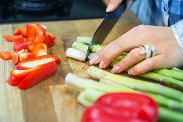 Woman chopping vegetables in the kitchen.