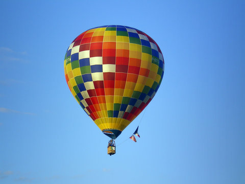 Mosaic and colored hot air ballon in the sky
