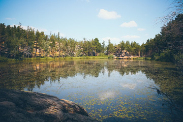 Mountain lake in the background of mountains and sky