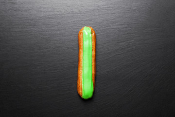 Group of french dessert Eclair on black background