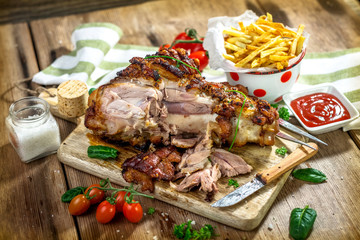 Roasted pork knuckle with french fries