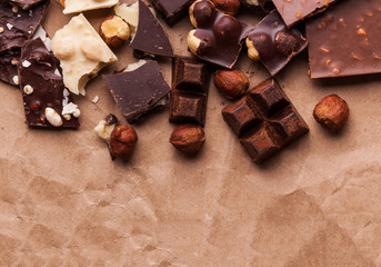 Variety of sweet homemade chocolate pralines on wooden background