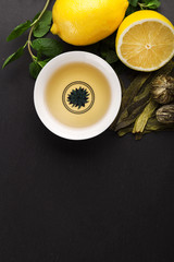 Tea cup with fresh mint leaves, closeup photo