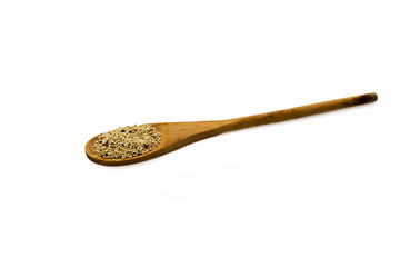 Wooden spoon with quinoa isolated