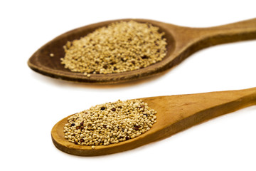 Wooden spoon with quinoa isolated