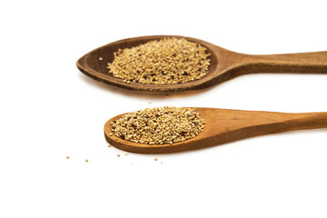 Wooden spoon with quinoa isolated