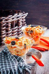 Fototapeta na wymiar Salad with squid and carrots in a bowl, selective focus