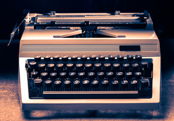 Typewriter with latin alphabet in toning