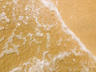 Sea waves reaching lapping to shore