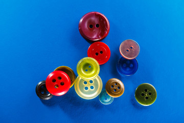 Colourful buttons on blue background