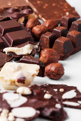Variety of sweet homemade chocolate pralines on wooden background