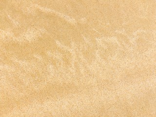 Texture on the yellow beach under sunshine