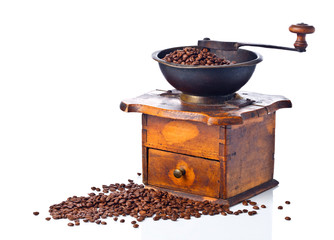  coffee grinder and roasted coffee beans isolated on white background