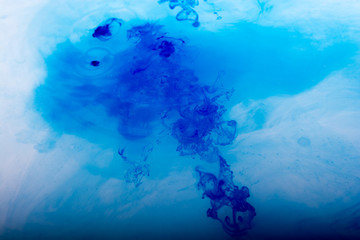 Paint dissolving in water