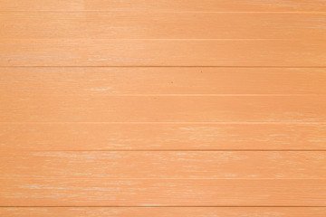 Fototapeta na wymiar Orange wood background. Painted scraped wooden board. Bright texture or pattern.