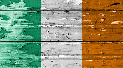 Ireland flag on wood texture background with old paint peels
