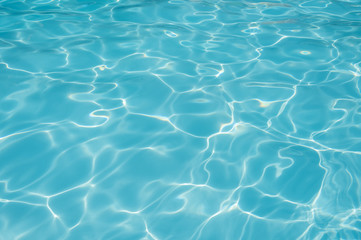 Naklejka na ściany i meble Blue and bright water surface and ripple wave in swimming pool
