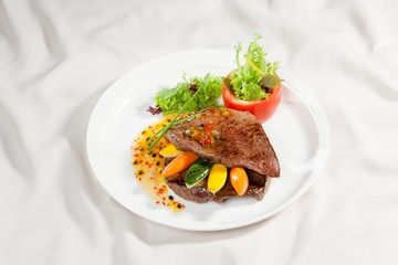 Fried beef with salad