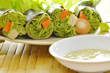 green oak and sausage wrapped by seaweed with spicy mayonnaise sauce