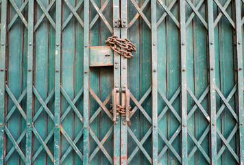 Locked lock metal door with a chain