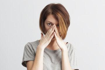 girl suffers from terrible headaches and compresses the head with fingers. Forget and remember something, suffer from illness