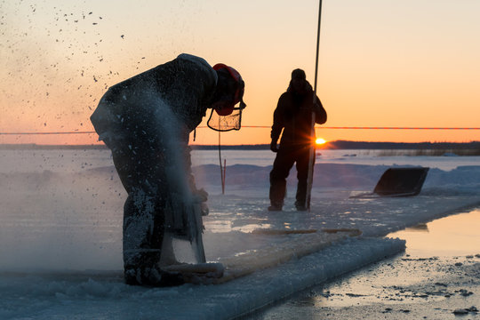 Sunset ice sawing