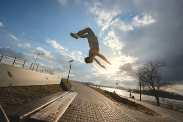 Foto op Plexiglas Young man doing parkour outdoor © areporter