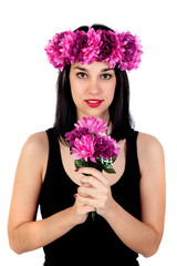 Beautiful brunette girl with purple flowers in her head