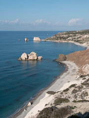 Fototapeta na wymiar PETRA TOU ROMIOU, CYPRUS: Aphrodite's rock and beach near Pafos