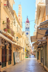 KERKYRA, CORFU, GREECE - Mart 4 2017: Tourists walking and shopping on narrow streets in the...