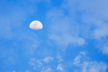 Moon on the blue sky. Full moon on the blue sky just before sunset.