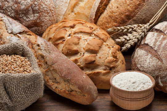 Bread arranged on wooden table