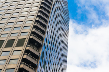 Commercial tower building window with blue sky