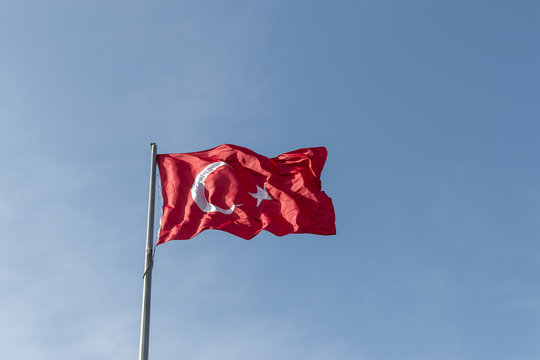 Turkey republic flag waving in the blue sky