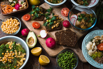 Different salad and snack on the wooden table horizontal