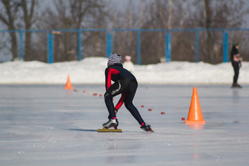 Winter sport - little boy on ice-rink - children's skating