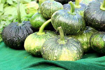 green pumpkins at market