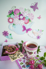 Obraz na płótnie Canvas five o'clock tea. Tea, chocolate, donuts 