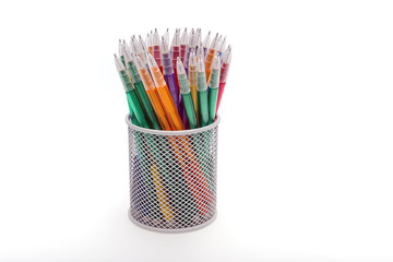 Colored pencils in a pencil case on white background