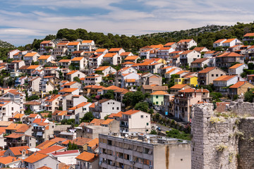 Fototapeta na wymiar Red roofs of Sibenik, an old town on Adriatic coast in Dalmatia, Croatia